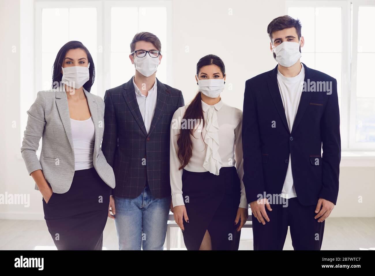Danger of infection of the virus coronavirus infection. Group people businesspeople in medical mask at office. Stock Photo