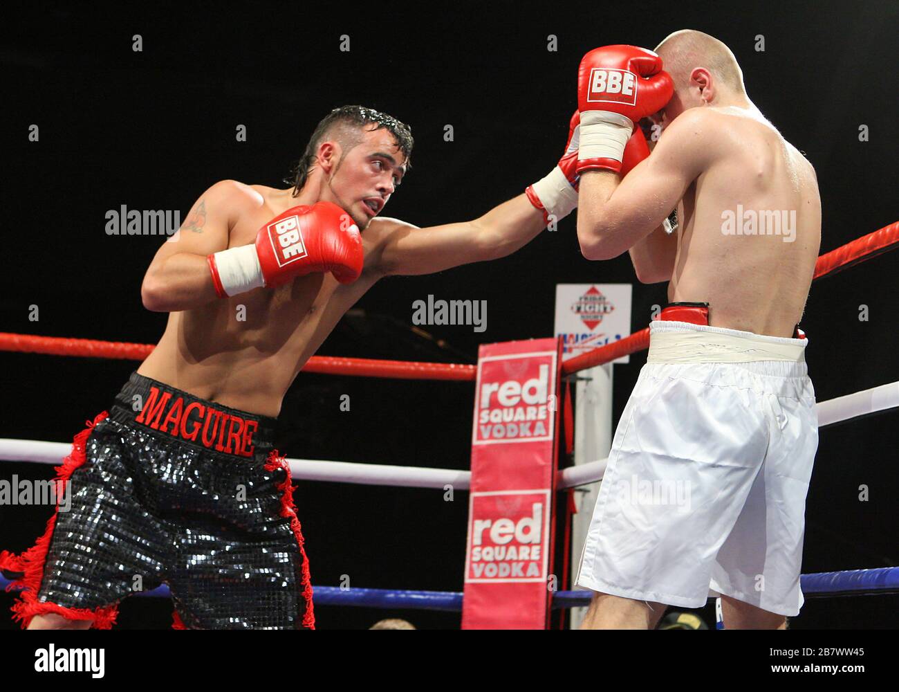 Michael Maguire (black/red shorts) defeats Pavels Senkovs in a Super-Bantamweight boxing contest at the Brentwood Centre, promoted by Frank Maloney Stock Photo