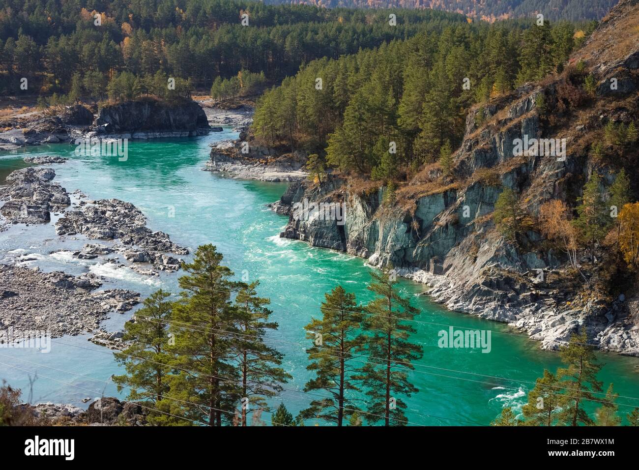 Beautiful view of the dark Turquoise Katun River in the rocky mountains of Altai on a sunny day. Altai Territory in Siberia Stock Photo