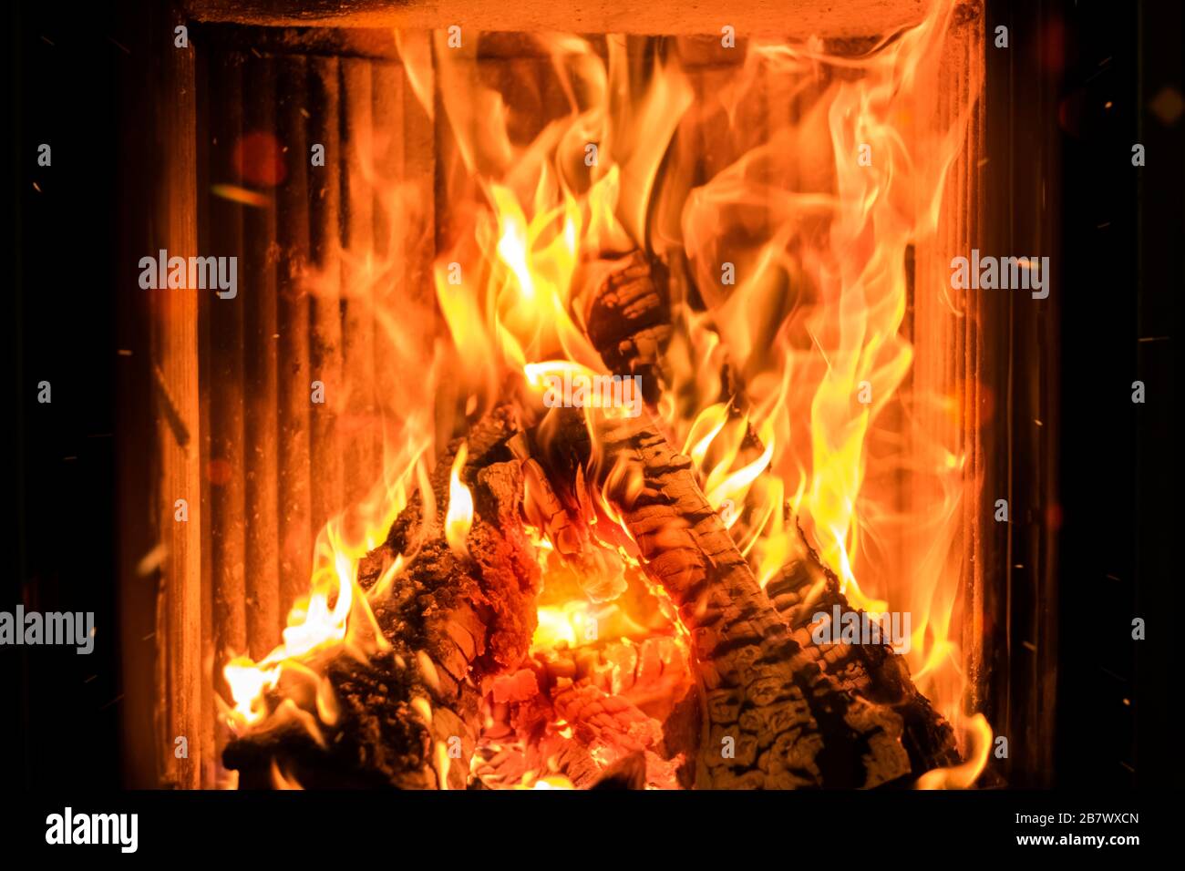 Burning firewood in the fireplace. Flame of fire. background, texture Stock Photo