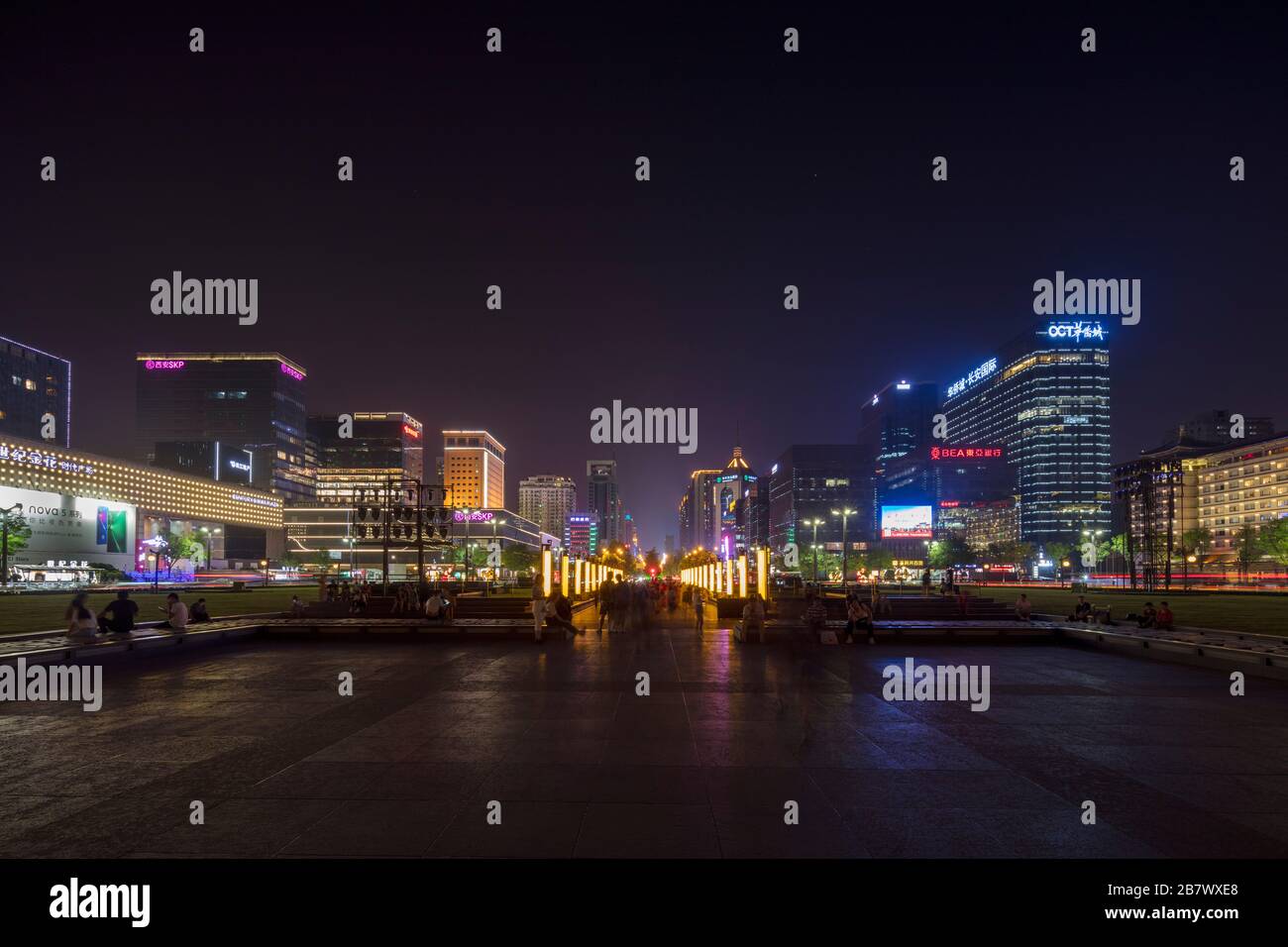 night view of Nanguan Main Street, Xian, China from Huancheng Park beside  Xi'an Wall Yongningmen North Gate. Stock Photo