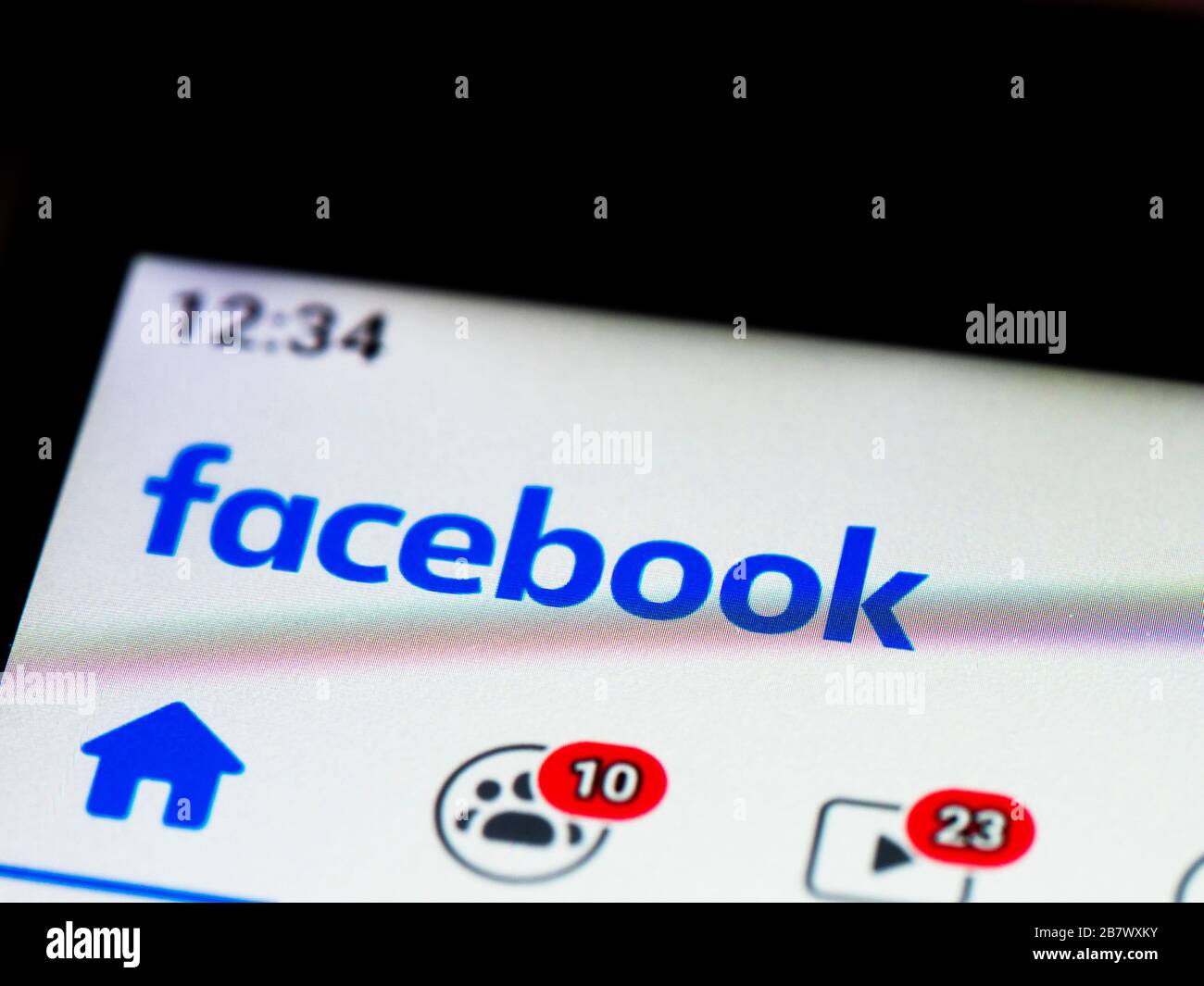 In this photo illustration Facebook logo is seen displayed on a smartphone Stock Photo