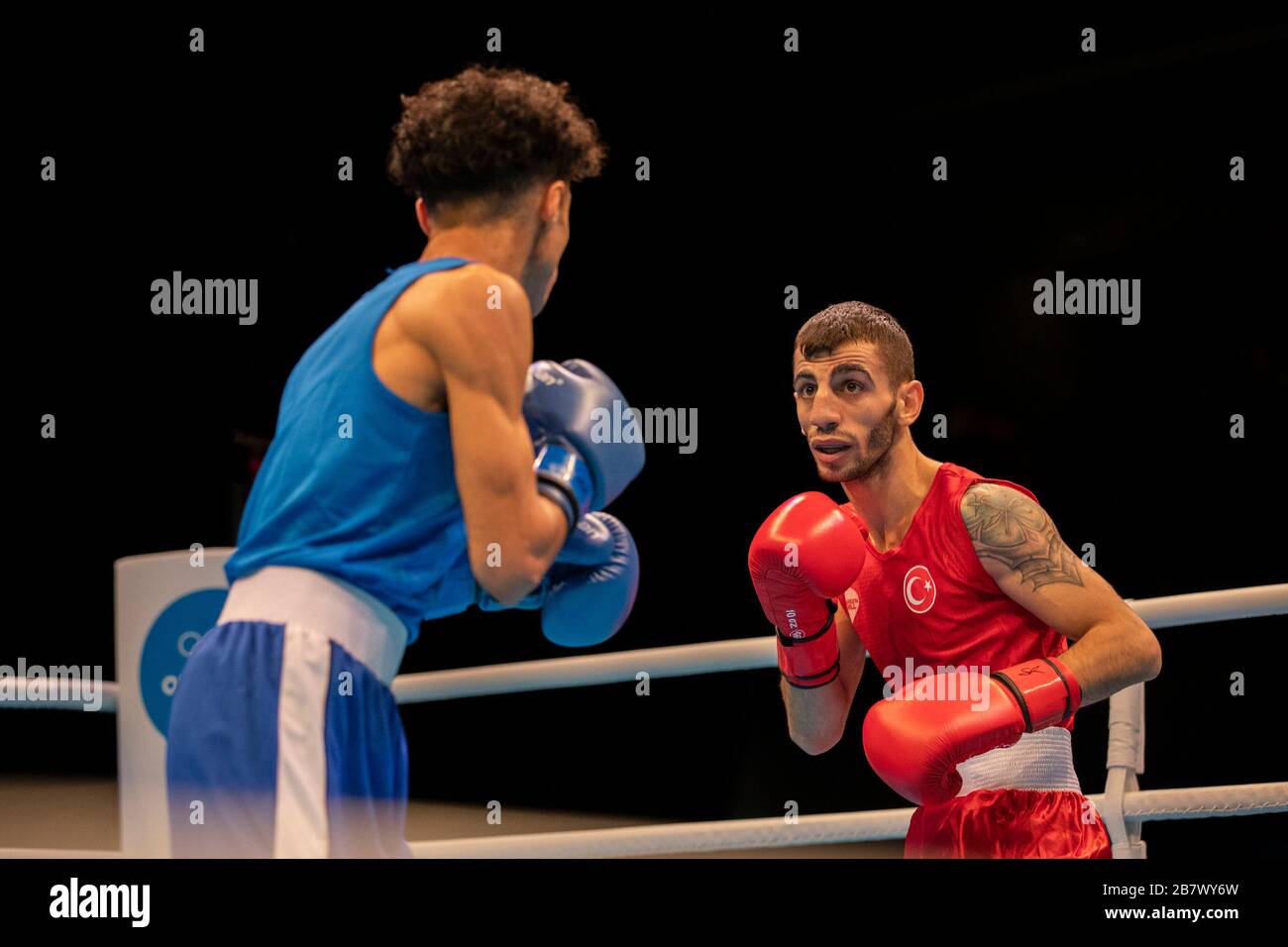 London, UK. 14-03-20. Batuhan Ciftci (TUR) RED & Zakaria Bouhdl (BEL) BLUE during the Road to Tokyo European Olympic Boxing Qualification Event. Stock Photo