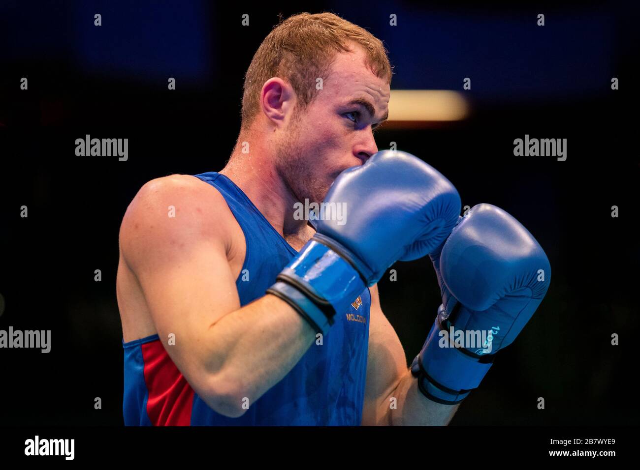 London, UK. 14-03-20. Besart Pireva (KOS) RED fights Andrei Vreme (MDA) BLUE during the Road to Tokyo European Olympic Boxing Qualification Event Stock Photo
