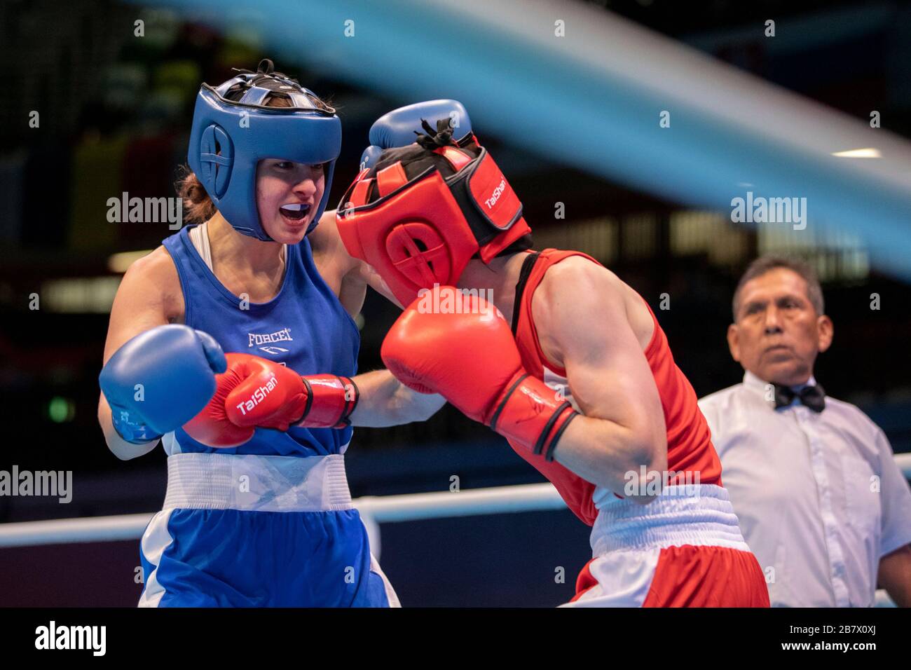 London, UK. 14-03-20. Delfine Persson (BEL) RED fights Nikoleta Pita (GRE) BLUE during the Road to Tokyo European Olympic Boxing Qualification Event. Stock Photo