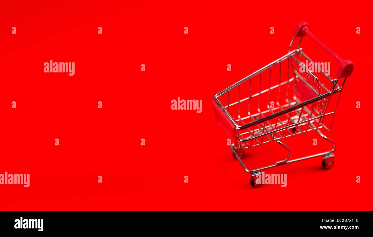 shopping basket on a red background Stock Photo - Alamy
