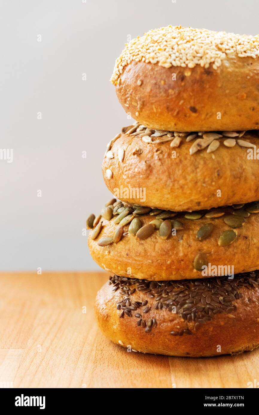 Stack of fresh home-made multi grain seeded bagels Stock Photo