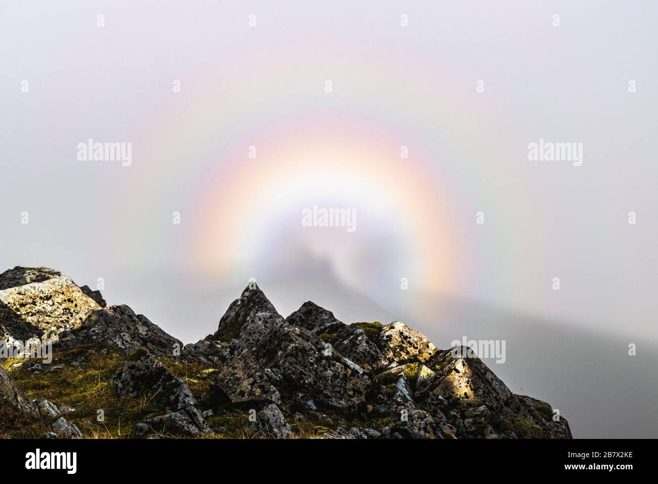 Glory rainbow, natural phenomenon, on a mountain top in dense fog in Glen Coe, Scotland. Stock Photo