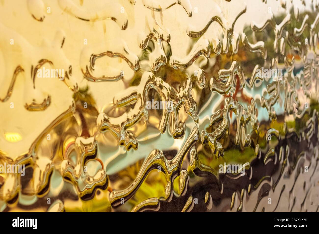 Gold Curved abstract metallic background. Abstract drops. texture Stock Photo
