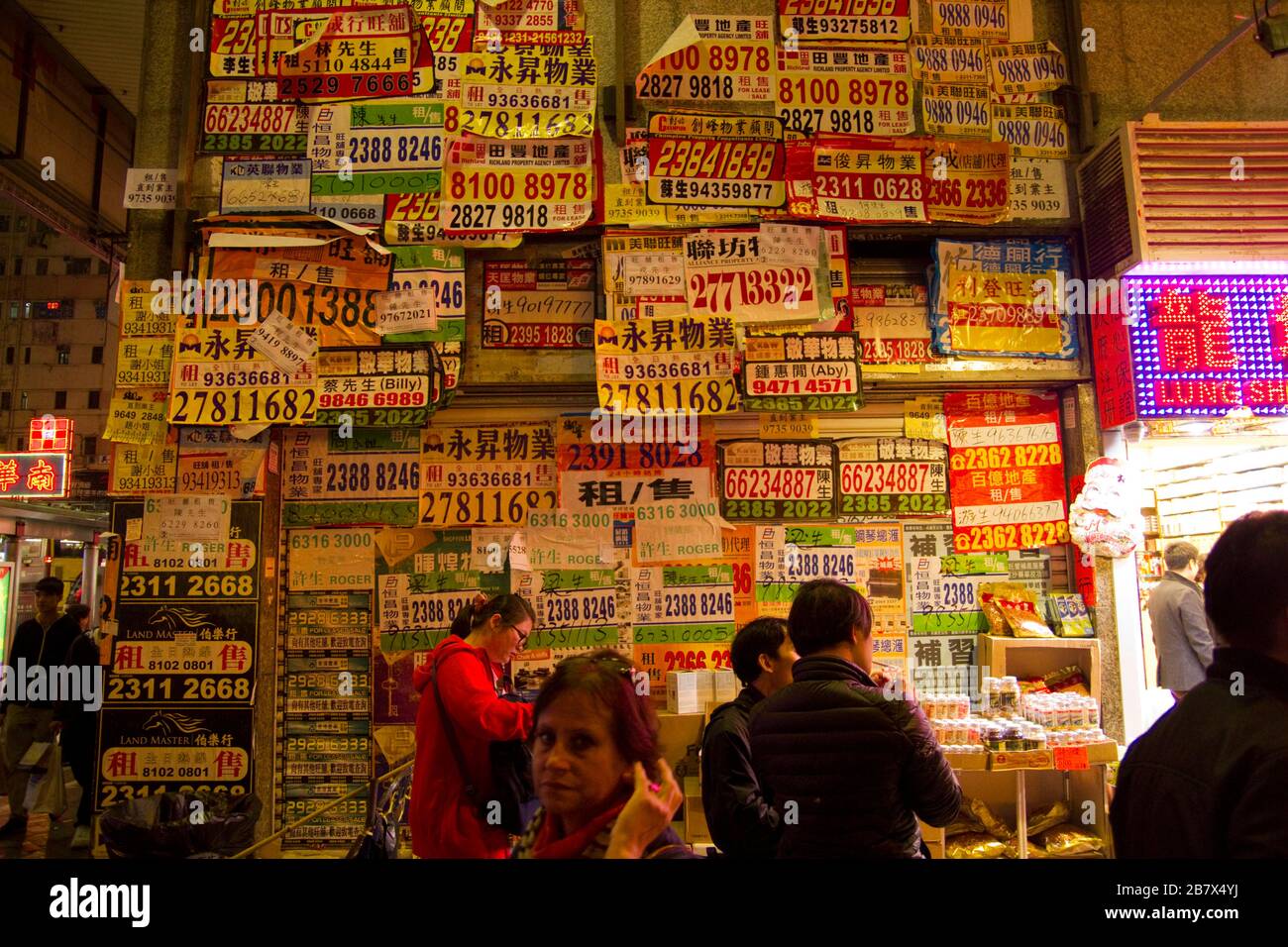 Wall of adverts with telephone numbers in Hong Kong Stock Photo Alamy