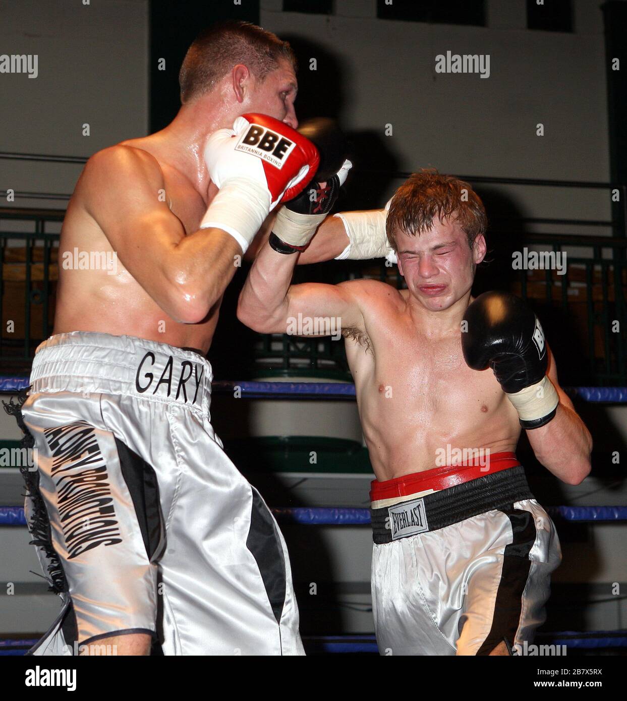 Gary Woolcombe (Bexleyheath, silver shorts) defeats Janis Chernouskis (Tukums, white shorts) in a LightMiddleweight boxing contest at York Hall Bethna Stock Photo