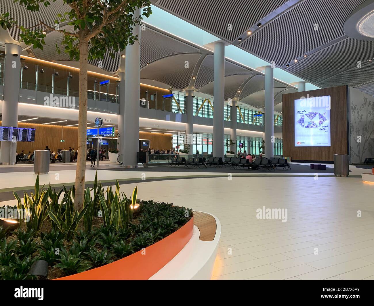 View of gate, seating area and a big advertisement screen at new Istanbul airport. Stock Photo