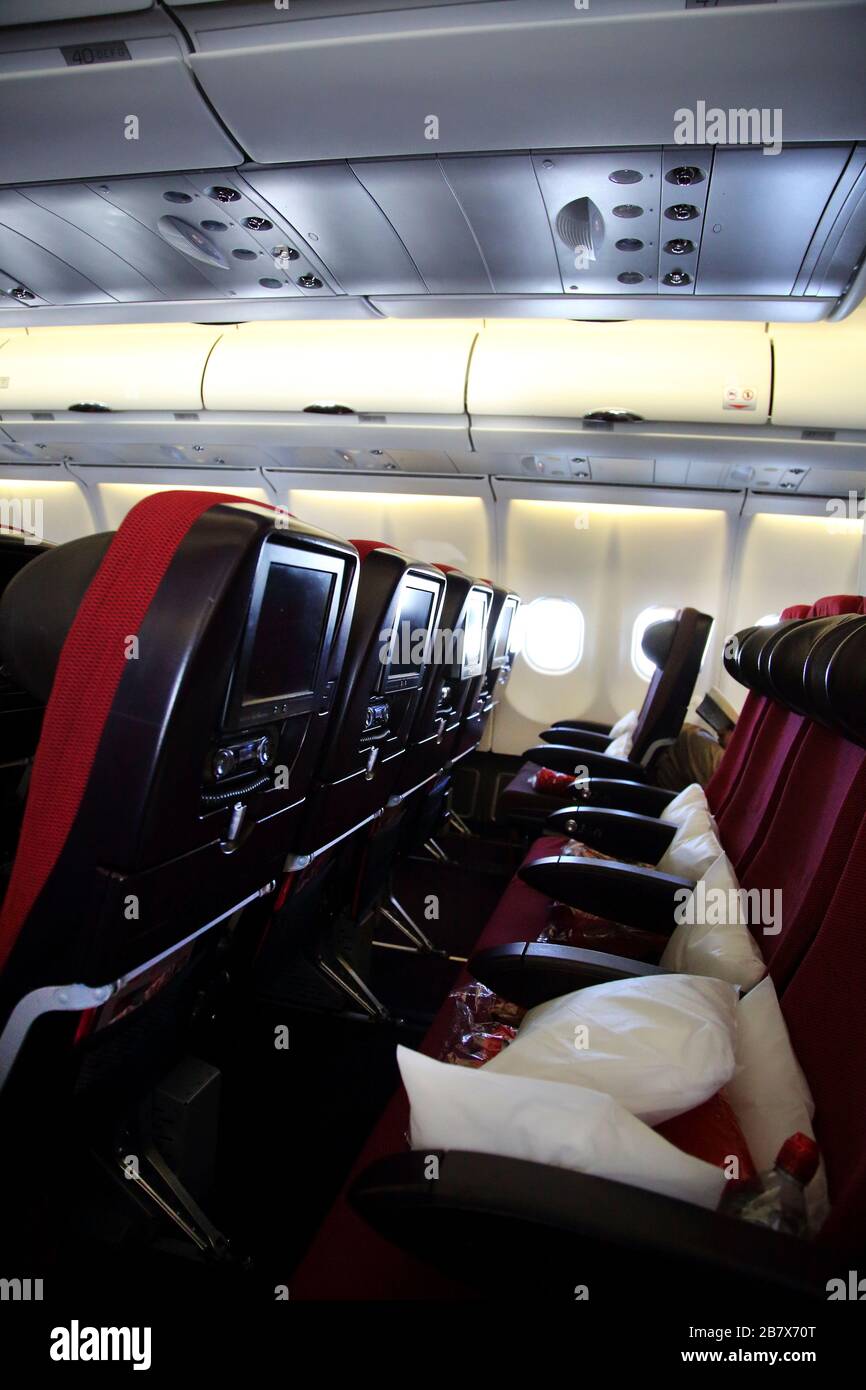 Interior of Aeroplane Boeing 747-400 (744) Showing Television Sets in the Head Rest of the Seats Stock Photo