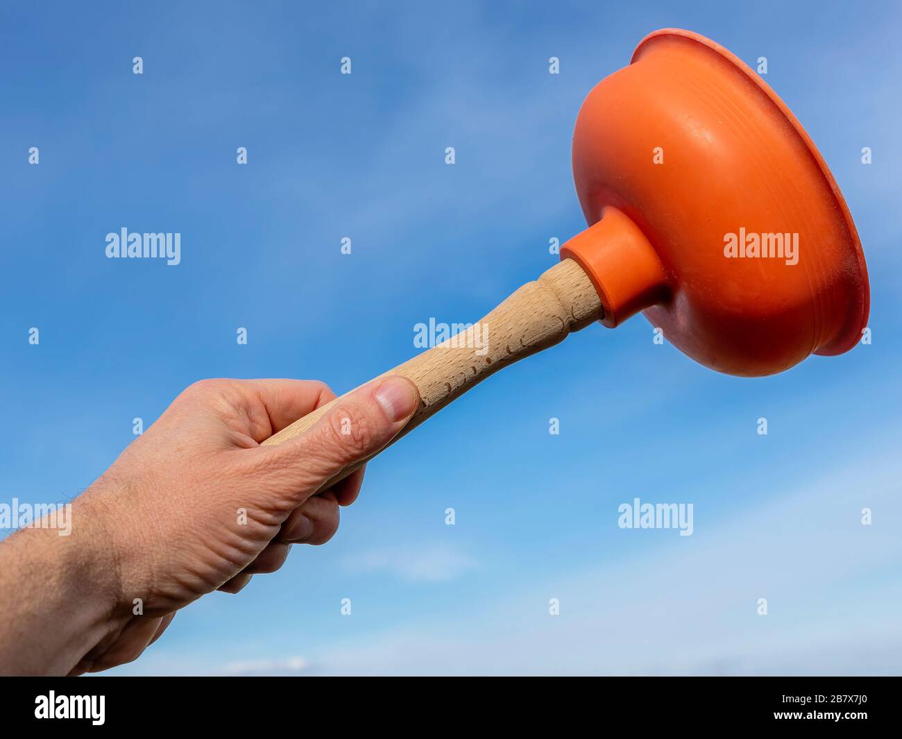 Plumber's drain cleaner tool. Rubber suction cup with wooden handle Stock  Photo - Alamy