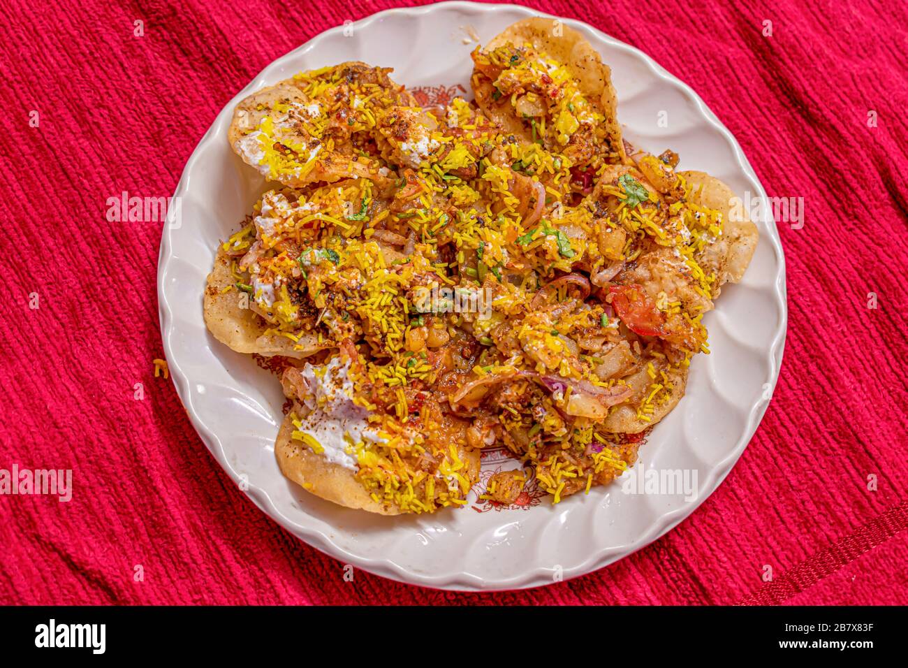 Sev Batata Puri OR Papdi chat is a popular Calcutta street food, a type of chaat, crispy, tangy, moderately healthy (Selective focus) Stock Photo