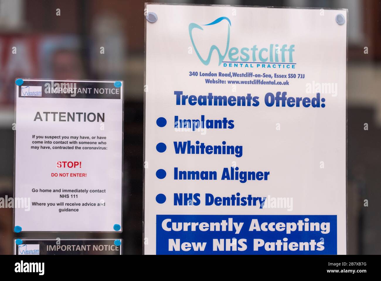 Westcliff Dental Practice with COVID-19 Coronavirus warning notice warning customers not to enter the office. Stop, do not enter sign on window Stock Photo