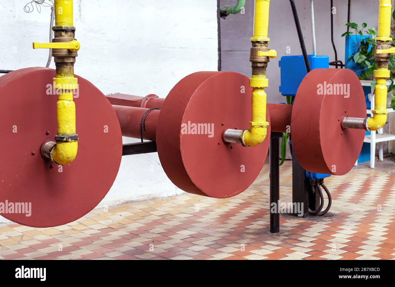 Gas burners on a hot water boiler in a gas boiler house. Gas boiler house equipment Stock Photo