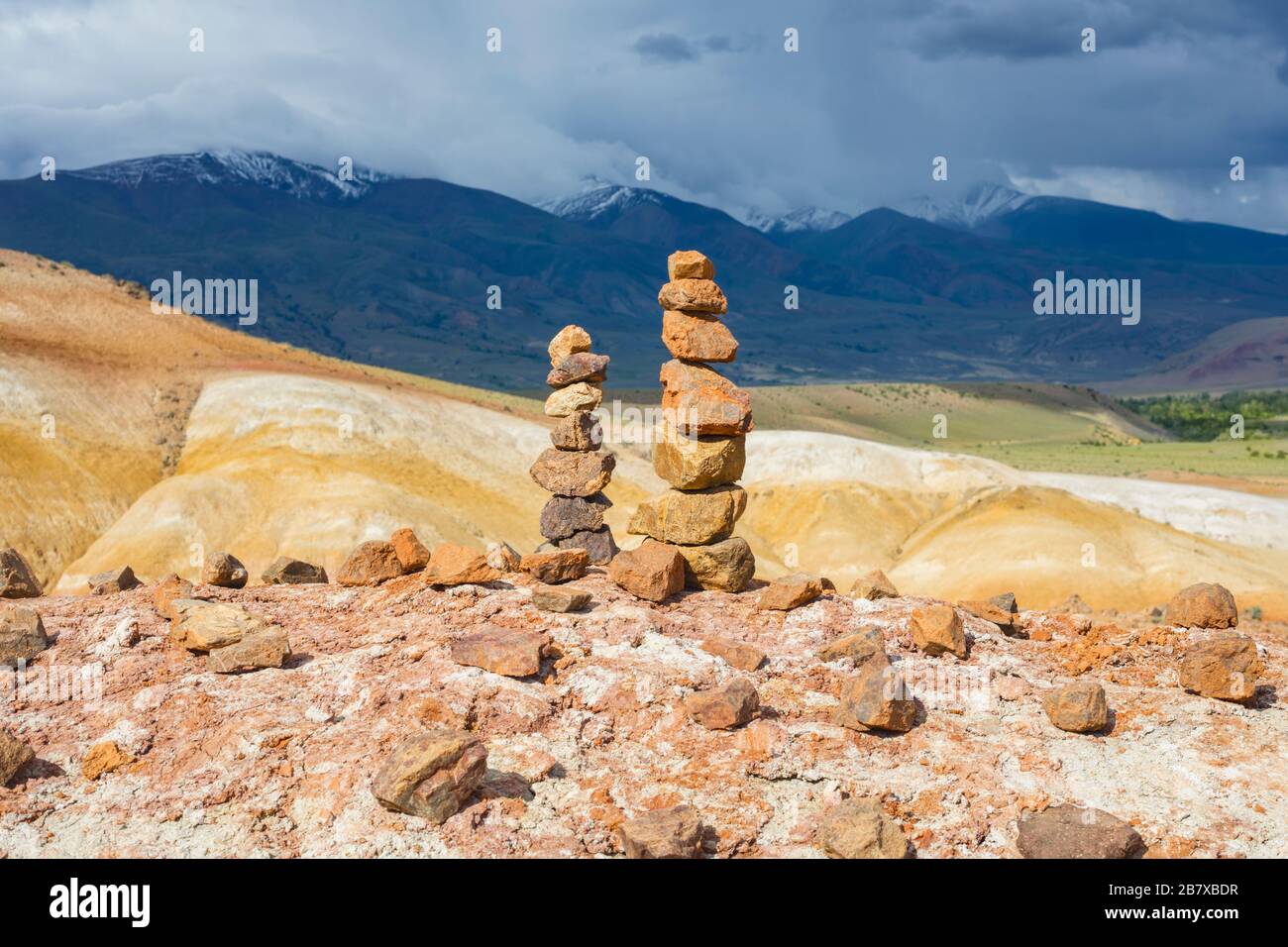 Balanced stone tower in the background of the beautiful Altai mountains. Relaxation concept Stock Photo