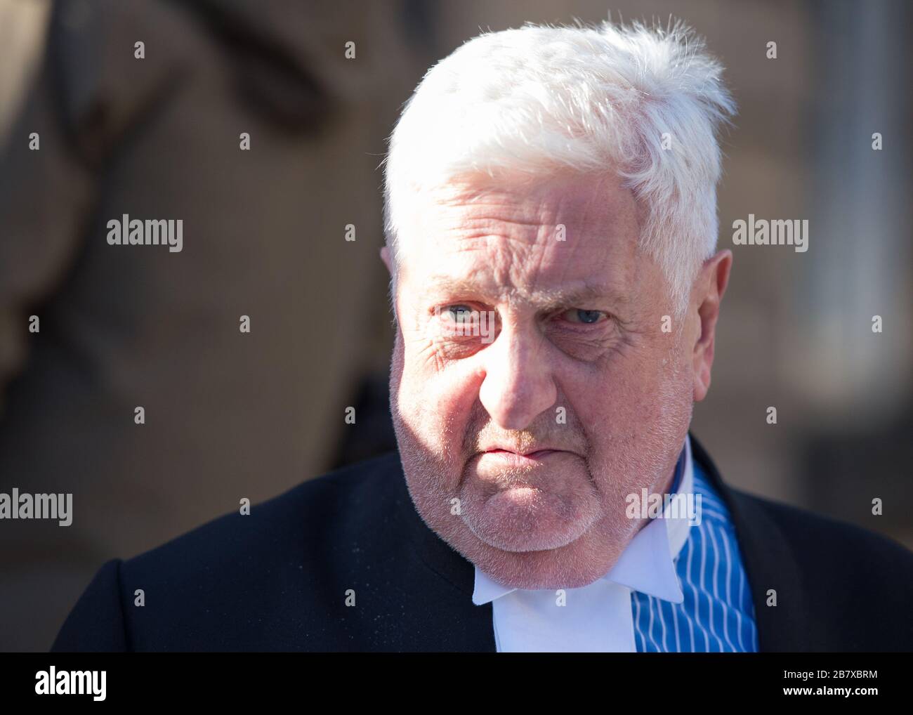 Edinburgh, UK. 18th Mar, 2020. Pictured: Gordon Jackson QC, Defence Advocate for Alex Salmond. A packed crowd consisting of awaiting Media, Press photographers and onlookers wait for him outside of the court. Credit: Colin Fisher/Alamy Live News Stock Photo
