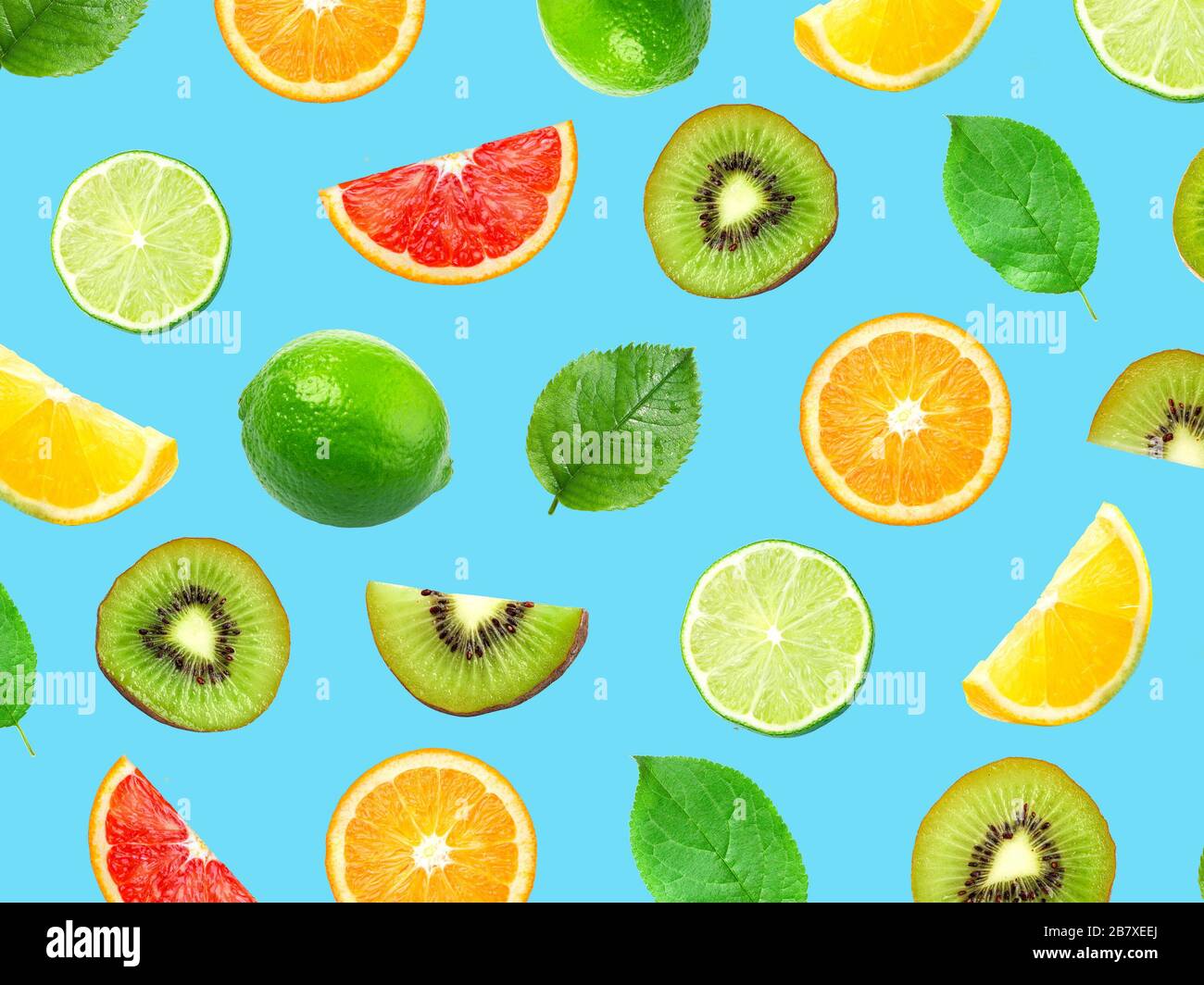 various citrus and kiwi fruits isolated on blue background, top view Stock Photo