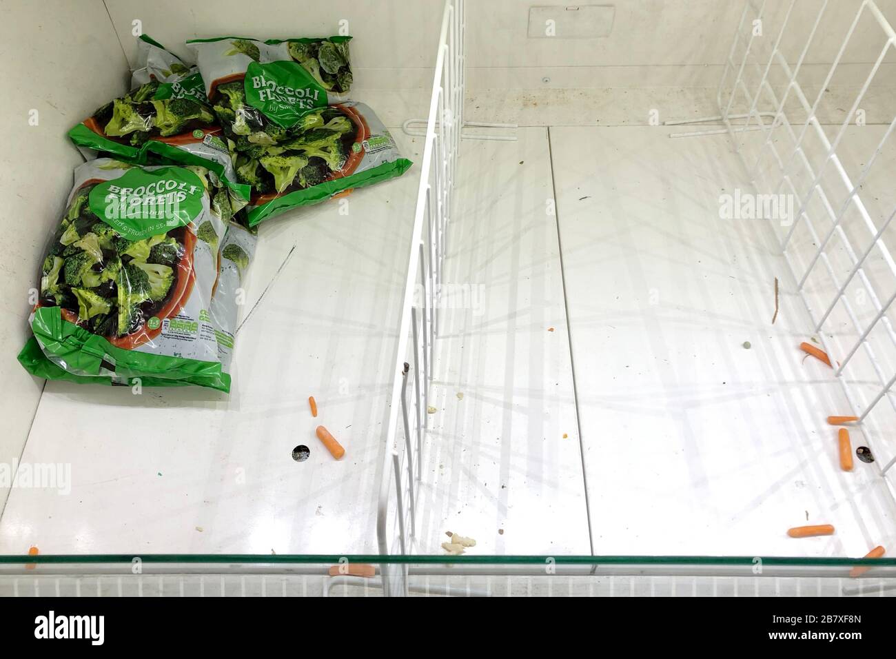 Empty shelves in a Sainsburys store on March 18, 2020 in Upton, Wirral, United Kingdom. Spates of 'panic buying' have cleared supermarket shelves Stock Photo