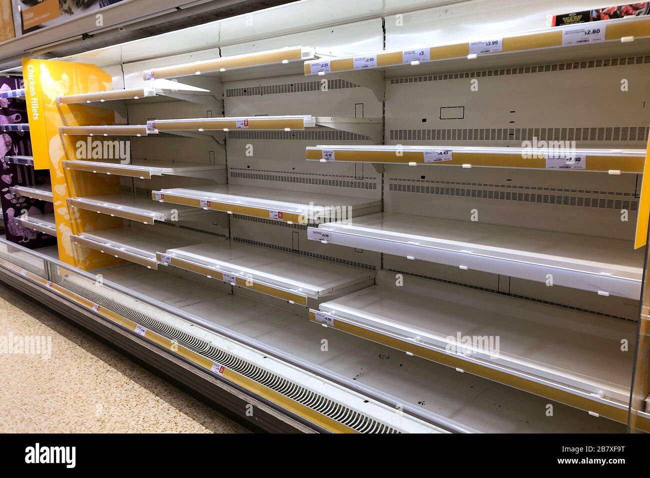 Empty shelves in a Sainsburys store on March 18, 2020 in Upton, Wirral, United Kingdom. Spates of 'panic buying' have cleared supermarket shelves of g Stock Photo
