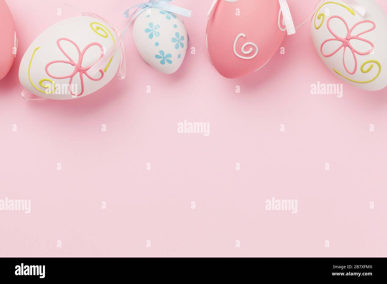 Easter greeting card with colorful easter eggs on pink background. Top ...
