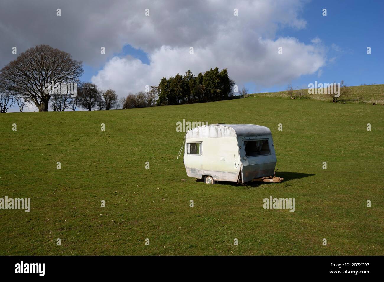 A caravan isolated in a field in Herefordshire. Stock Photo