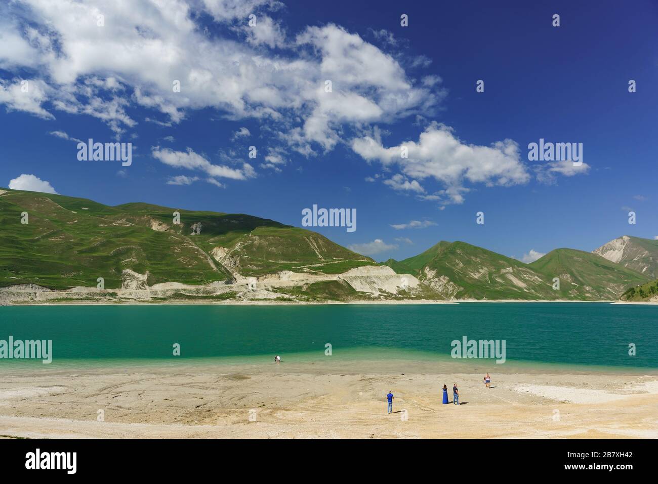 People on the shore of the mountain lake Kezenoi Am in Vedensky district of the Chechen Republic, Russia. Weekend in early summer Stock Photo