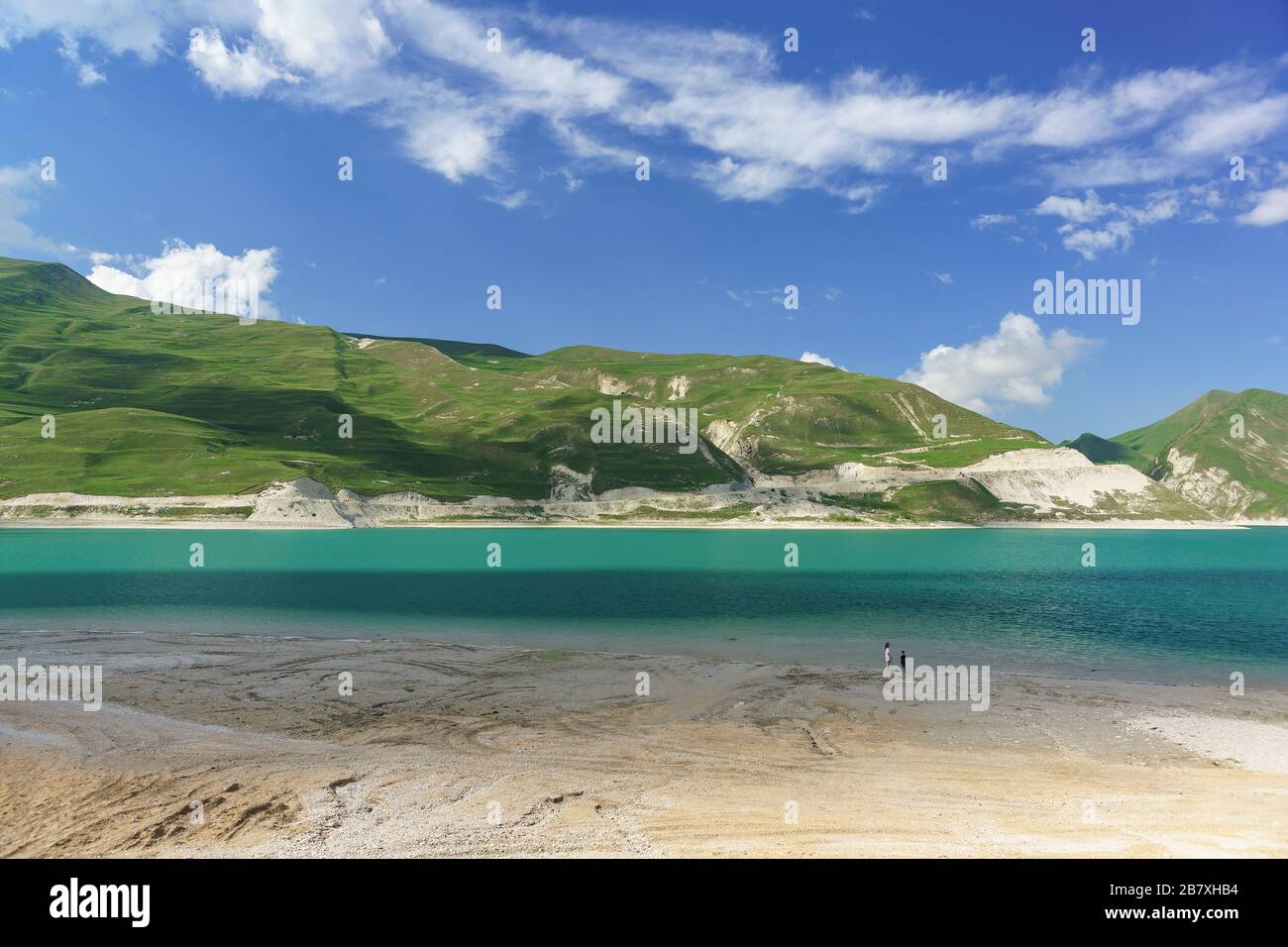 Woman and child on the shore of the mountain lake Kezenoi Am in Vedensky district of the Chechen Republic, Russia. Weekend in early summer Stock Photo