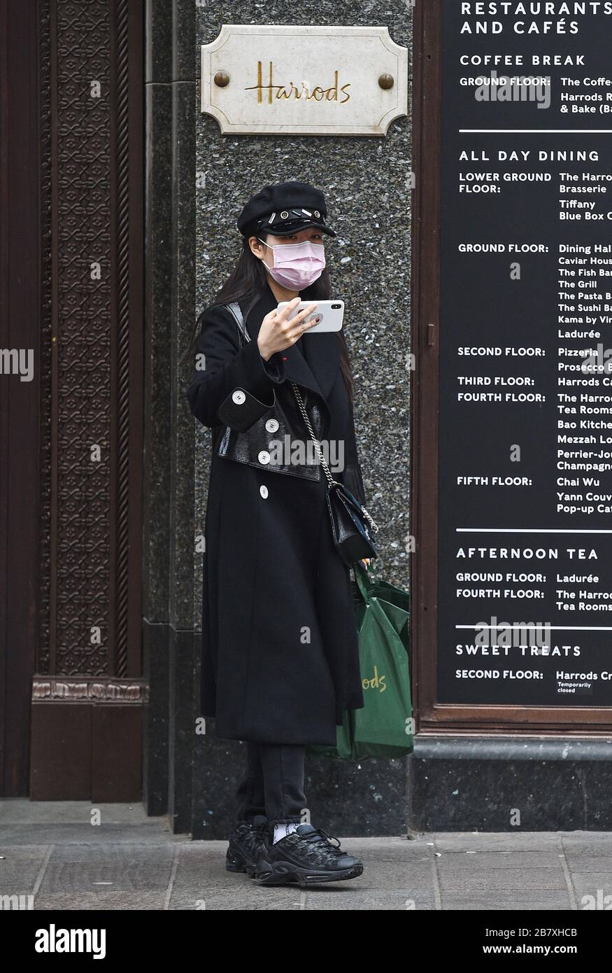 A Woman Wearing A Mask Outside Harrods In Knightsbridge London After The Department Store Cut Back Opening Times Stock Photo Alamy A Woman Wearing A Mask Outside Harrods In Knightsbridge London After The Department Store Cut Back Opening Times Stock Photo Alamy