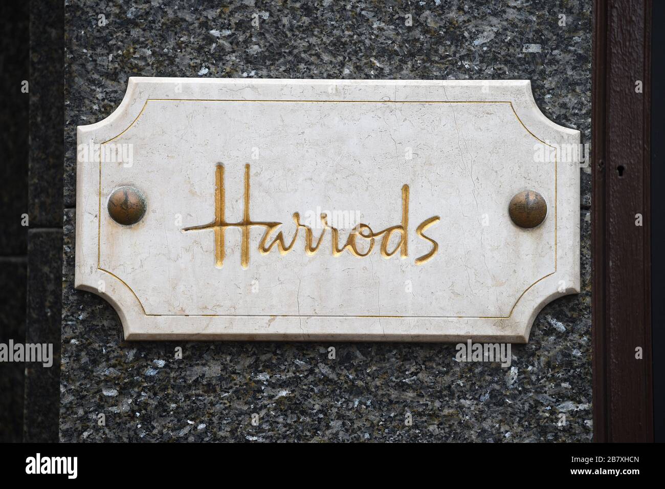 A general view of the Harrods sign in Knightsbridge, London after the department store cut back opening times. Stock Photo