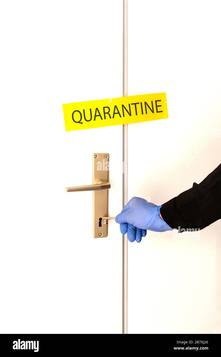 Coronavirus quarantine, locked room, hand in glove closed the door. Worldwild pandemic,security health. Stock Photo