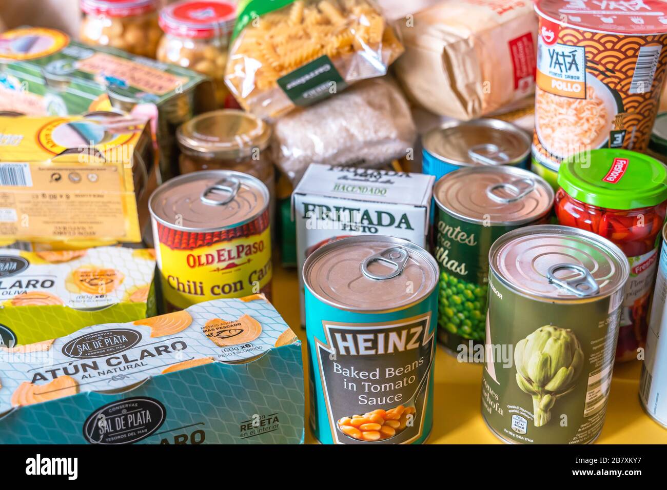 Home food pantry storage of provision to survive Coronavirus COVID 19 pandemic during quarantine. Canned tuna, pasta, oat and other basic grocery Stock Photo