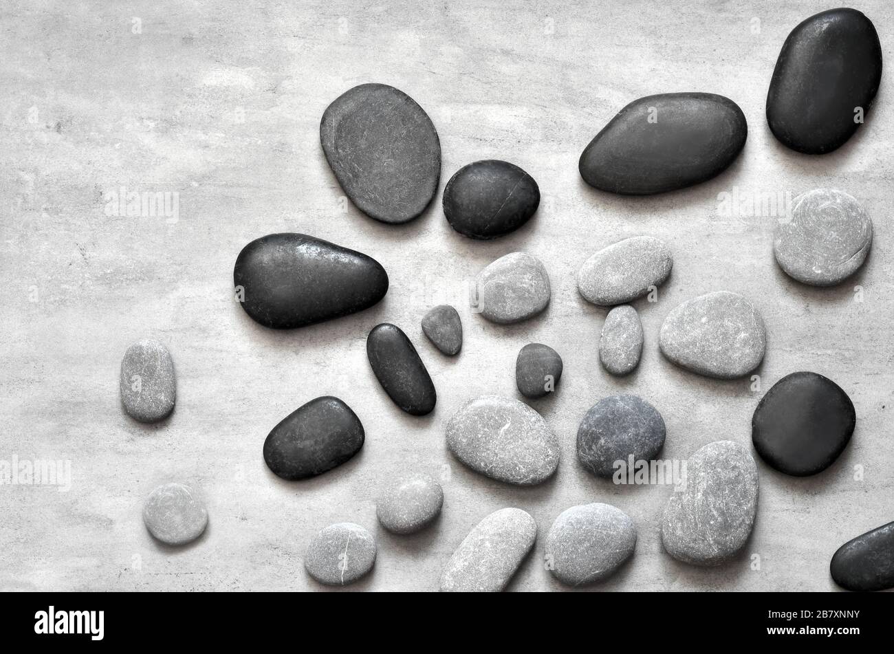 Flat lay composition with grey spa stones on grey background Stock ...