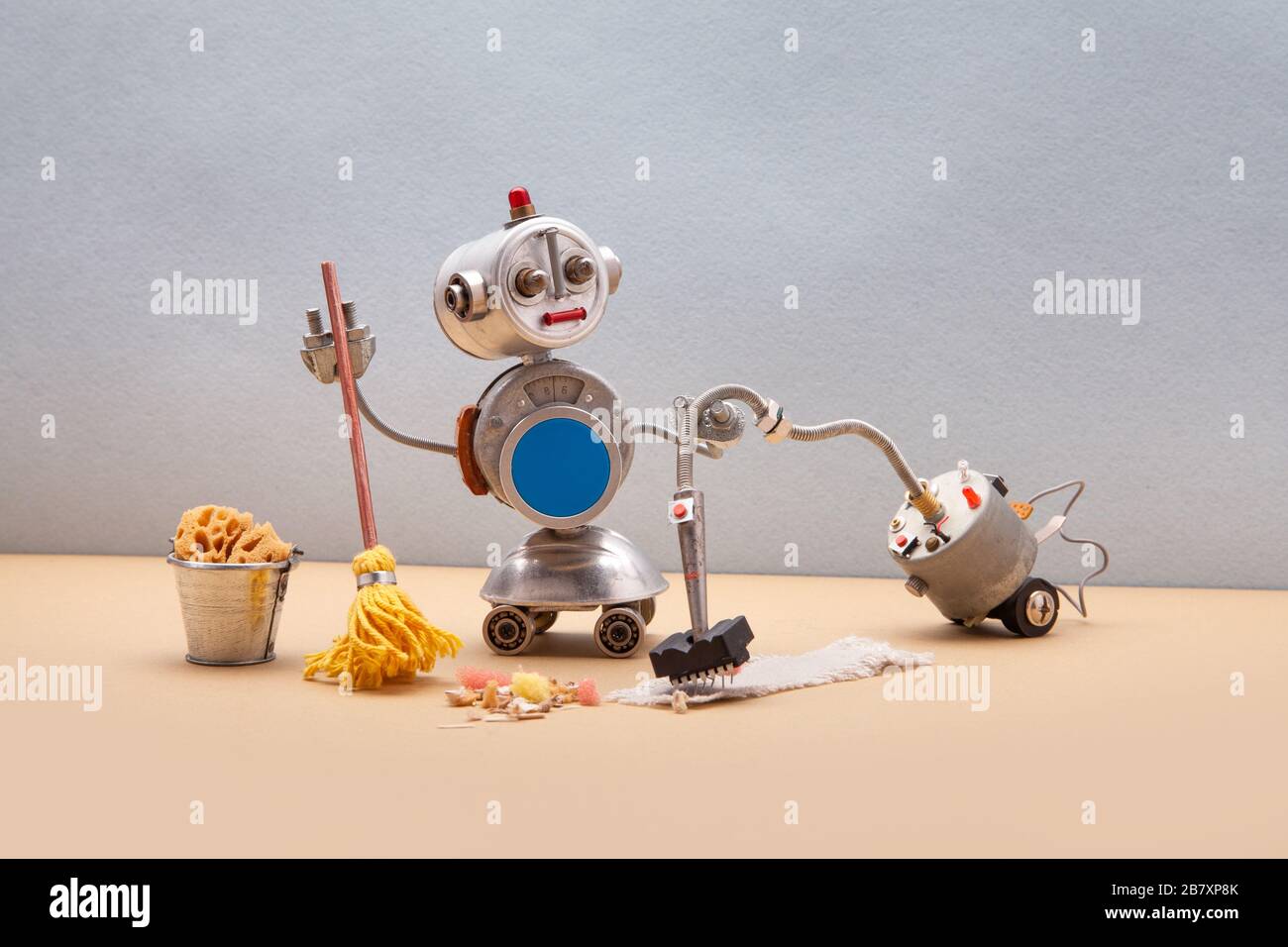 Domestic robot janitor with vacuum cleaner machine disinfects sanitize  room, vacuuming and sweeping floor and carpet. Autonomous disinfection  service Stock Photo - Alamy