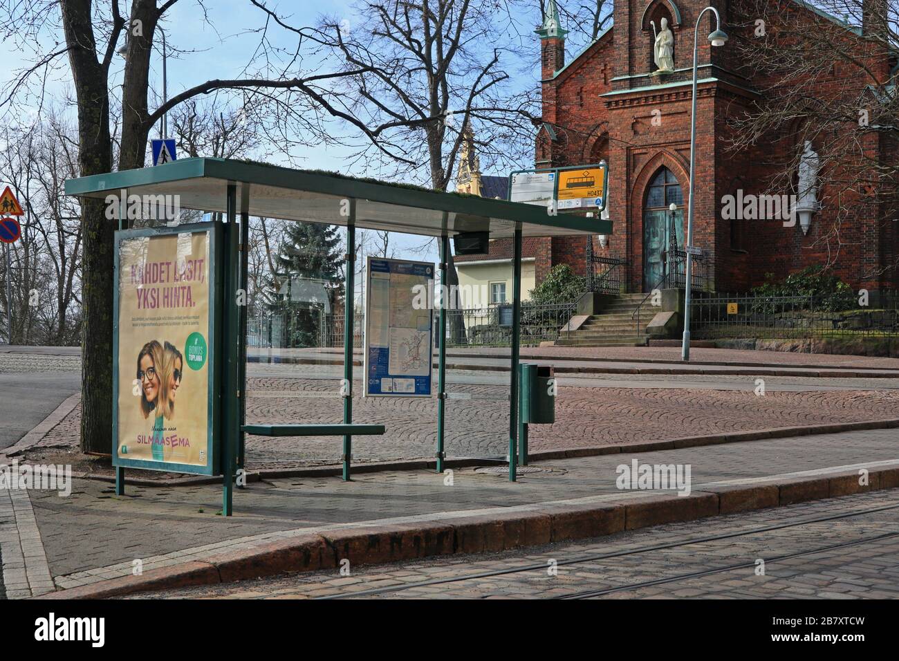 Helsinki, Finland. March 18, 2020. Empty tram stop with empty street during Coronavirus pandemic in Helsinki. Stock Photo