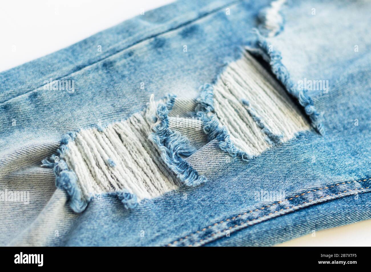 Ripped denim detail hi-res stock photography and images - Alamy