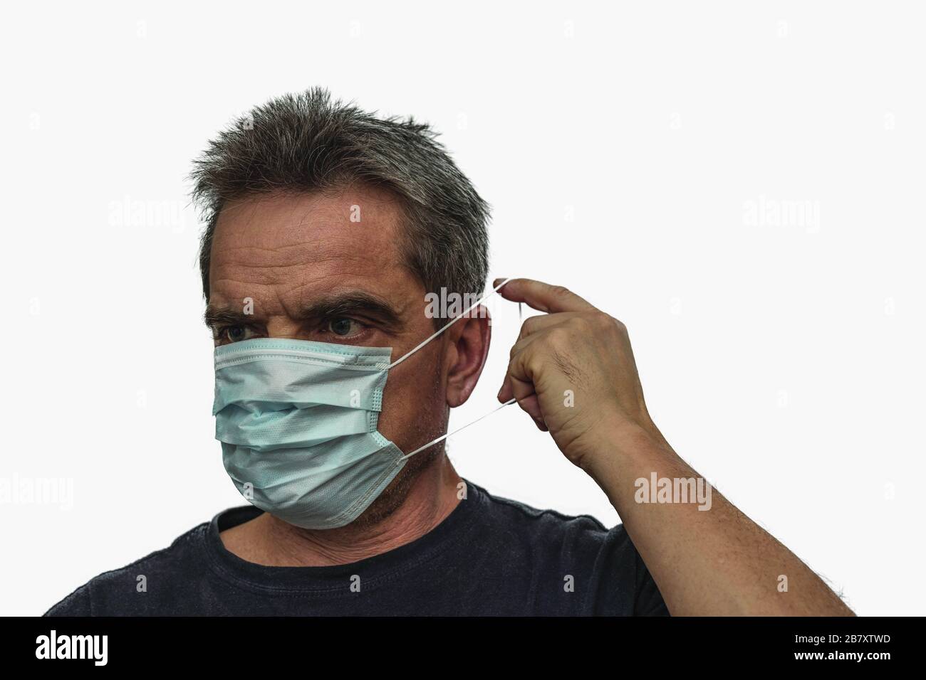 Close up view of man in white face mask. Influenza virus concept. Stock Photo