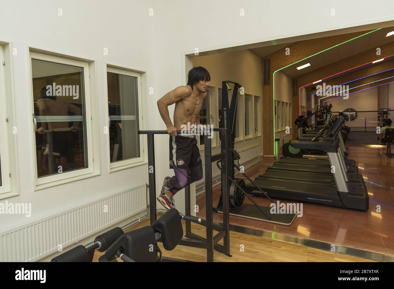 Close up view of young male training in gym. Sport and healthy lifestyle concept. Enkoping. Sweden. Stock Photo