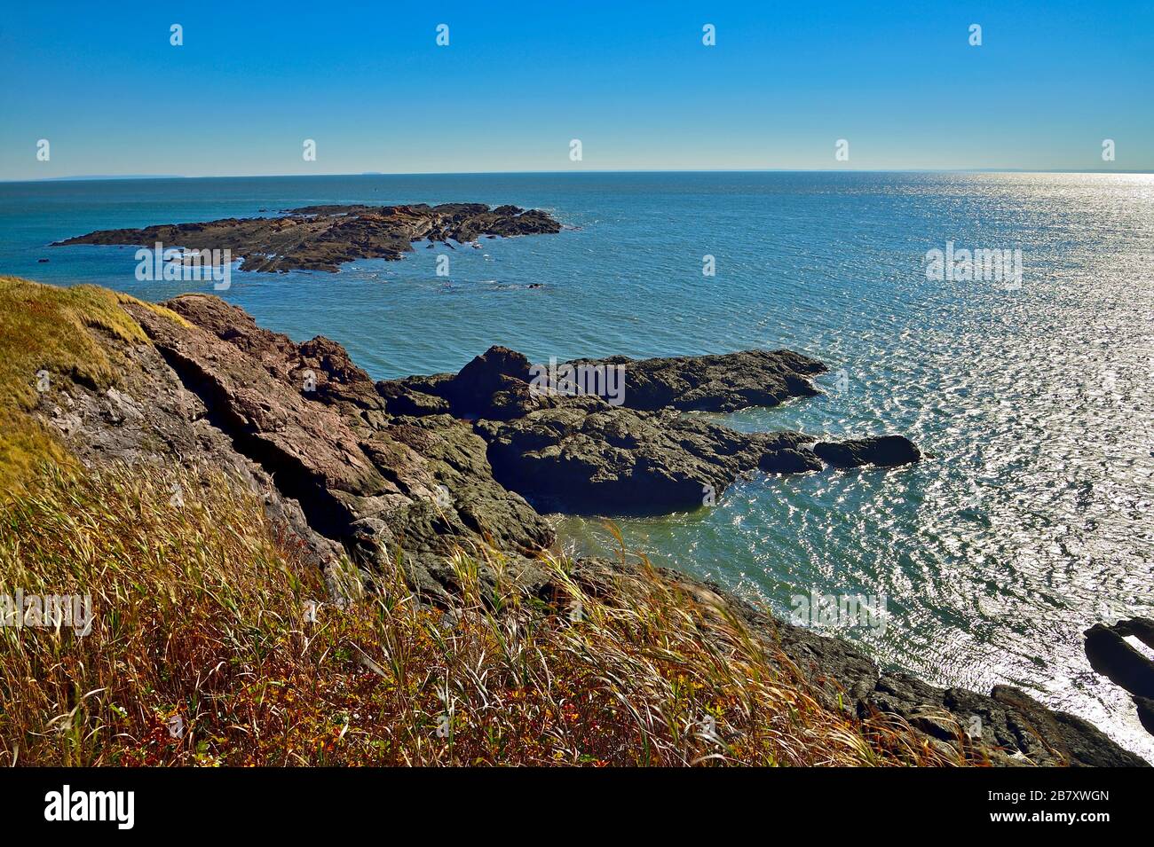 A landscape image of the Atlantic coast along the Bay of Fundy near Saint Martins New Brunswick Canada Stock Photo