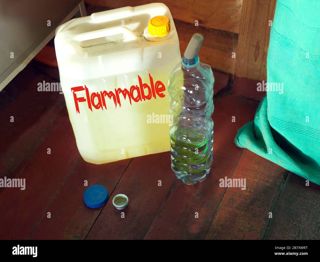 Flammable liquid in plastic canister placed on a floor, concept of danger Stock Photo Alamy