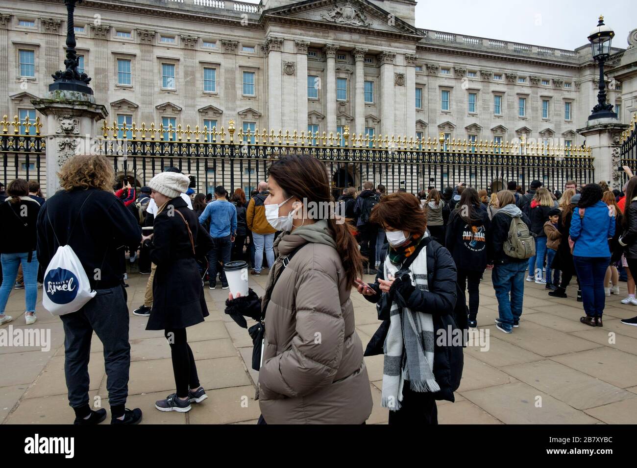London, UK 18 March 2020. Visitors to London continue to gather at Buckingham Palace to watch the Changing of the Guard Ceremony despite concerns over Covid-19 and mass gatherings. Stock Photo