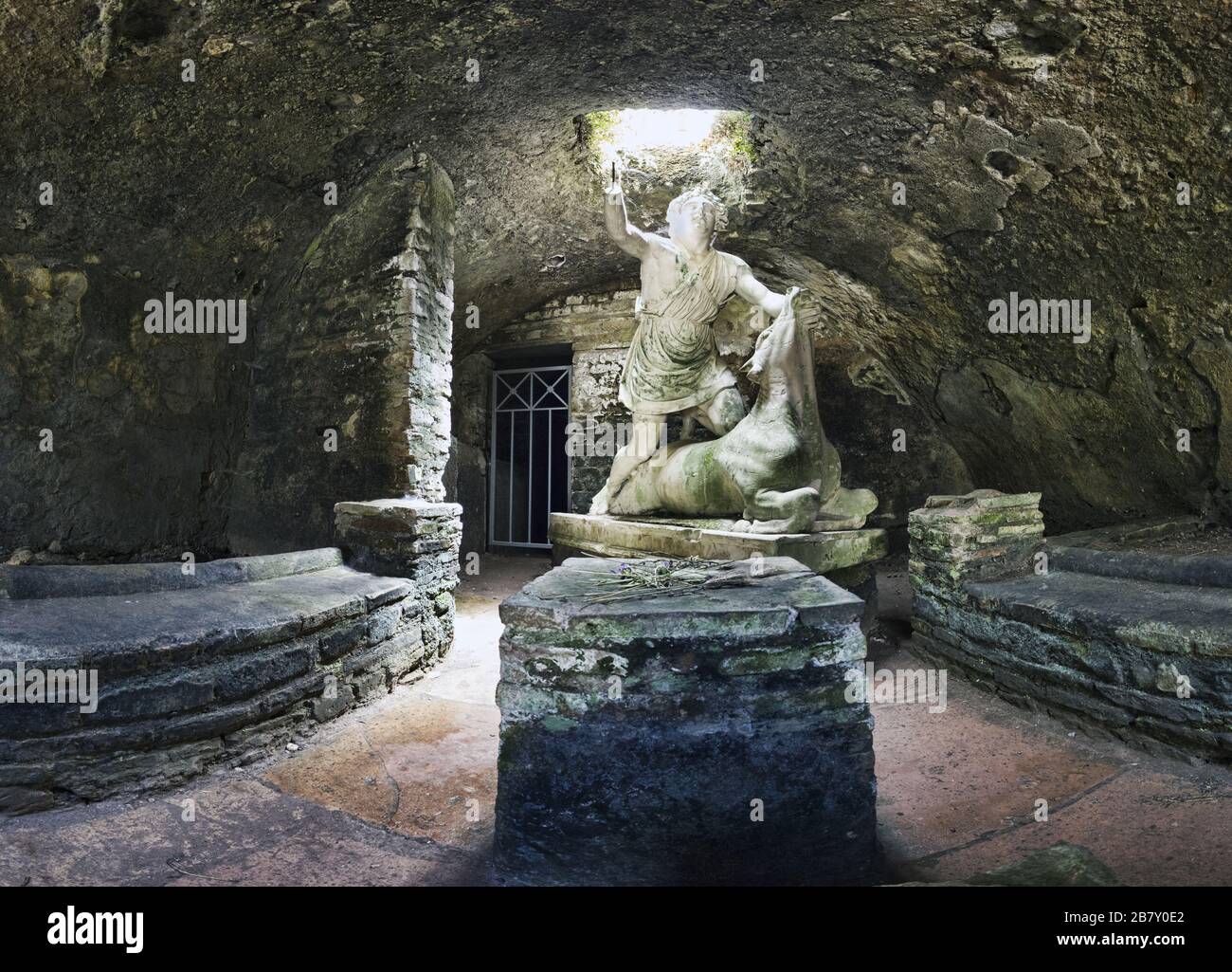 Immersive view of God Mithras statue in the act of killing bull to sacrifice it, the beautiful cave is located in the thermal s mithraeum in archaeolo Stock Photo