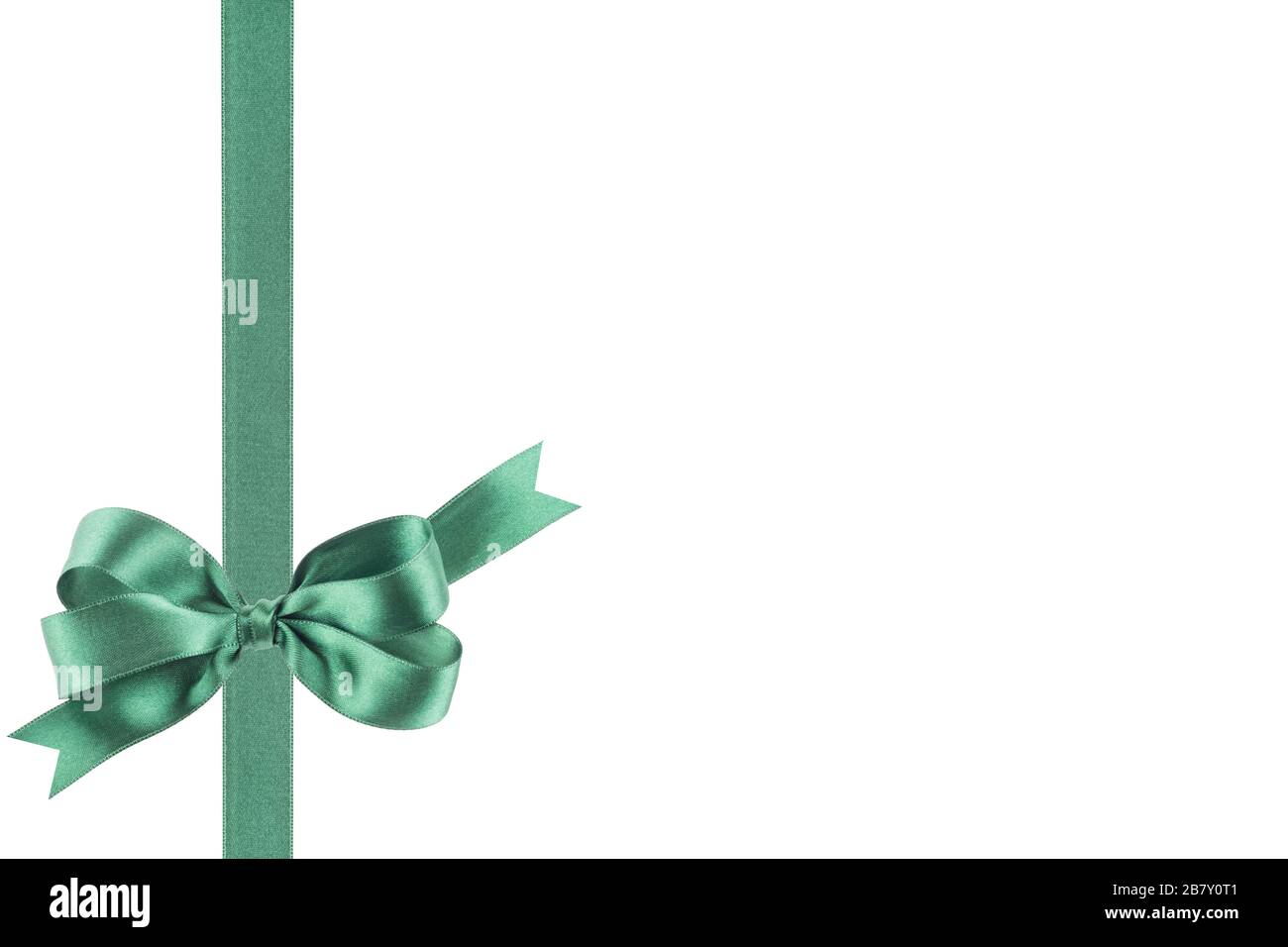 Curly, glittery green ribbon for gift wrapping on a white