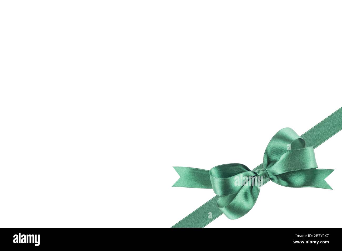 Green ribbon with a bow on white background Stock Photo - Alamy