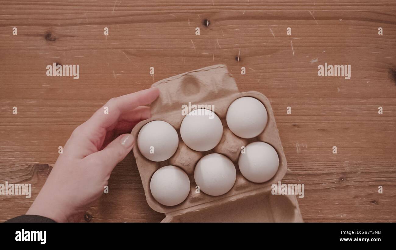 Flat lay. Step by step. Organic white eggs in egg crate Stock Photo Alamy