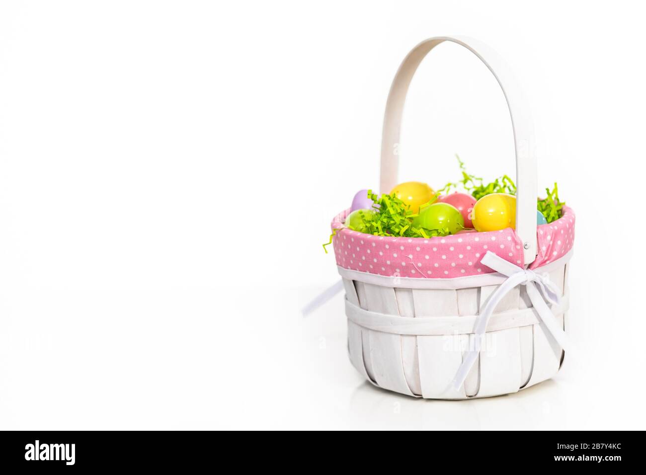 Easter basket with easter eggs on a white background Stock Photo - Alamy