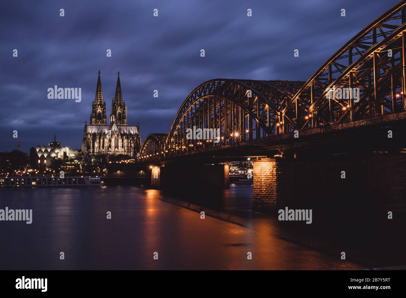 Cologne Cathedral and Hohenzollern Bridge at Night Stock Photo