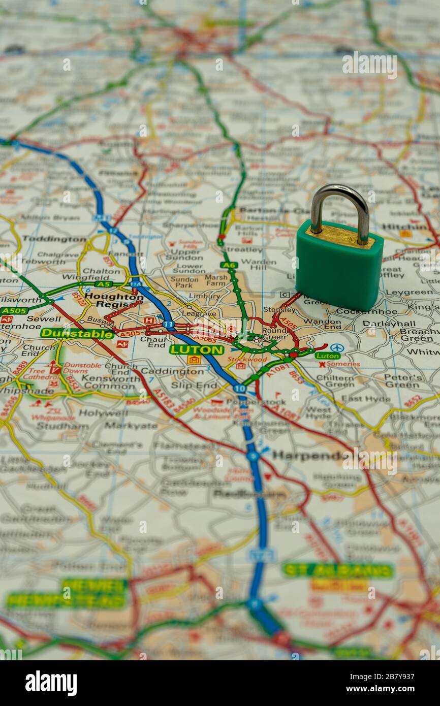 Luton Shown on a road map or geography map with a padlock on top to represent a city in lock down Stock Photo
